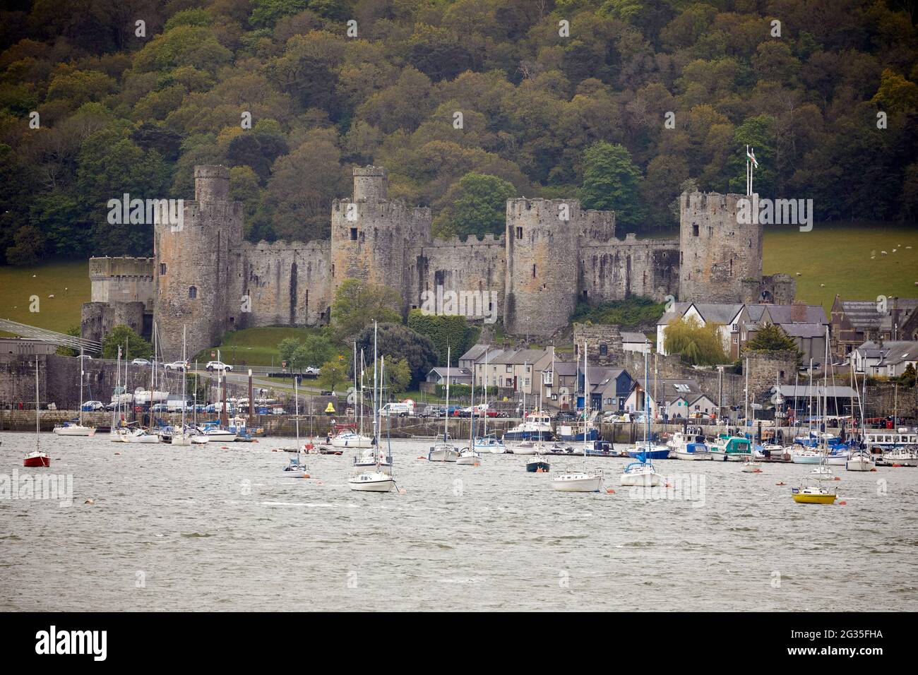 Conwy Castle fortification in Conwy, North Wales. seen from Deganwy across the `River Conwy into the quay area marina Stock Photo